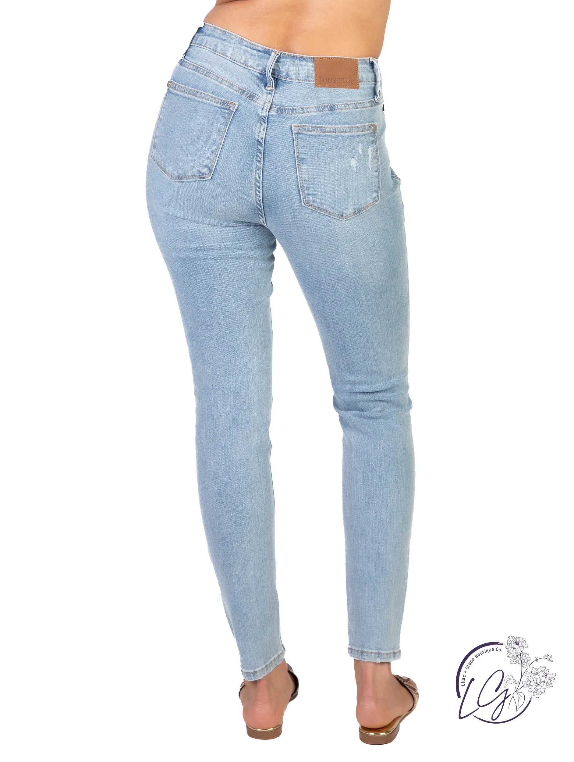 Celeste Mid-Rise Tummy Control Distressed Jeans by Judy Blue